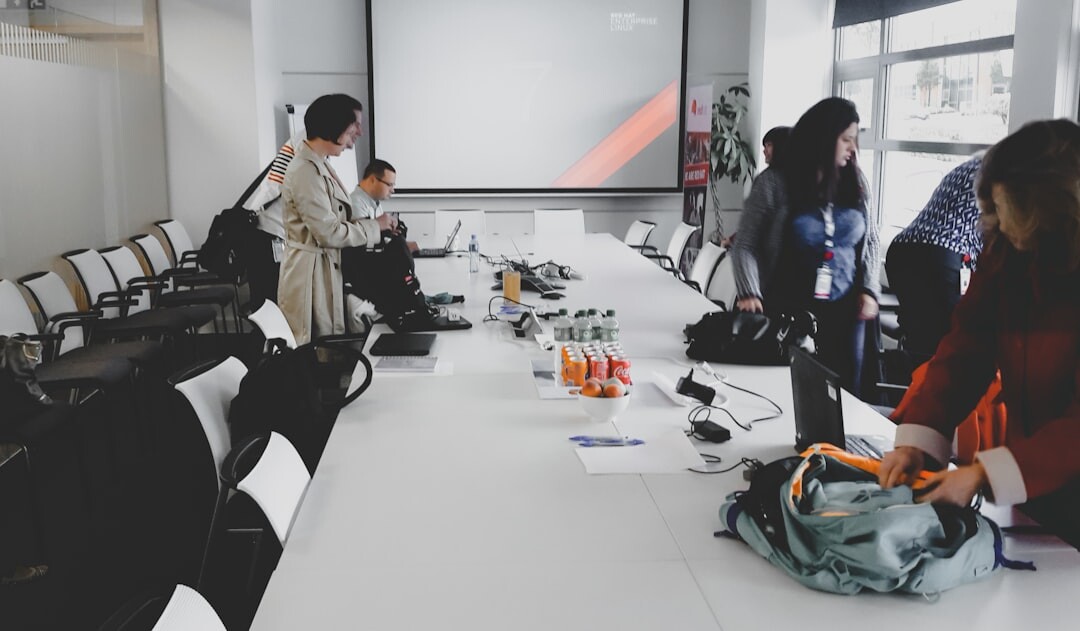Trainers planning a multicamera training program around a table