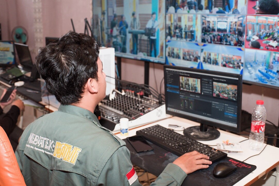 Technicians reviewing multicamera video feeds in a control room